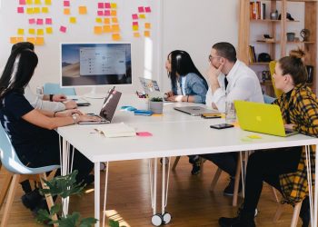 A picture of a newly started business having a team meeting.